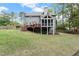 Exterior home view of large backyard, deck and screened-in porch at 2811 Shady Valley Ne Dr, Brookhaven, GA 30324