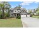 Charming two-story home with stone accents, manicured lawn, and a three-car garage at 2811 Shady Valley Ne Dr, Brookhaven, GA 30324