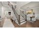 Bright foyer with hardwood floors, staircase and dining room view for elegant home entrance at 2811 Shady Valley Ne Dr, Brookhaven, GA 30324