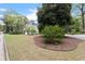 Charming two-story home featuring a well-manicured front yard with mature trees and lush landscaping at 2811 Shady Valley Ne Dr, Brookhaven, GA 30324