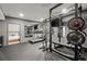 Home gym including weight rack, exercise equipment, mirror, and connected bedroom at 2811 Shady Valley Ne Dr, Brookhaven, GA 30324