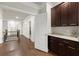 Upstairs hallway with dark hardwood floors, white trim, and a snack bar at 2811 Shady Valley Ne Dr, Brookhaven, GA 30324