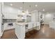 Gourmet kitchen boasts marble countertops, island with breakfast bar, and stainless steel appliances at 2811 Shady Valley Ne Dr, Brookhaven, GA 30324