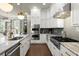 Modern kitchen with stainless appliances, kitchen island, and plenty of storage and view into the living area at 2811 Shady Valley Ne Dr, Brookhaven, GA 30324