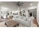 Spacious living room with open floor plan, modern fan, hardwood floors, and lots of natural light at 2811 Shady Valley Ne Dr, Brookhaven, GA 30324