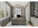 Home office featuring custom shelves, a large desk, and natural light through window shutters at 2811 Shady Valley Ne Dr, Brookhaven, GA 30324