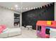 Basement playroom with chalkboard wall, colorful decor, and a playhouse creates a fun area at 2811 Shady Valley Ne Dr, Brookhaven, GA 30324
