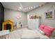 Basement playroom with chalkboard wall, colorful decor, and a sitting area for relaxation at 2811 Shady Valley Ne Dr, Brookhaven, GA 30324