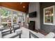 Relaxing screened porch with comfortable seating, a fan, and view of the landscaped backyard at 2811 Shady Valley Ne Dr, Brookhaven, GA 30324