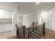 Upstairs landing with staircase and view of bathroom and laundry room at 2811 Shady Valley Ne Dr, Brookhaven, GA 30324