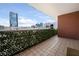 Spacious balcony with tile flooring, leafy screen and views of city buildings at 3435 Kingsboro Ne Rd # 603, Atlanta, GA 30326