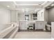 Bright bathroom with double vanity, soaking tub, and updated fixtures at 3435 Kingsboro Ne Rd # 603, Atlanta, GA 30326
