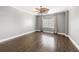 Large bedroom featuring a ceiling fan, window with curtains, and hardwood floors at 3435 Kingsboro Ne Rd # 603, Atlanta, GA 30326