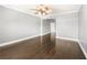 Neutral bedroom featuring a decorative ceiling fan and gleaming hardwood floors at 3435 Kingsboro Ne Rd # 603, Atlanta, GA 30326