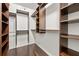 Large walk-in closet with custom wood shelving providing excellent storage solutions at 3435 Kingsboro Ne Rd # 603, Atlanta, GA 30326