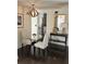 Dining area with glass table, two chairs, and view of the kitchen featuring stainless steel appliances at 3435 Kingsboro Ne Rd # 603, Atlanta, GA 30326