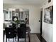 Dining room with dark wood table and chairs, adjacent to the kitchen with stainless steel appliances at 3435 Kingsboro Ne Rd # 603, Atlanta, GA 30326