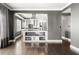 Open-concept dining room and kitchen with hardwood floors, neutral tones, and modern decor at 3435 Kingsboro Ne Rd # 603, Atlanta, GA 30326