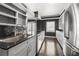 Modern kitchen features stainless steel appliances, dark countertops and hardwood flooring at 3435 Kingsboro Ne Rd # 603, Atlanta, GA 30326