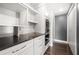 Bright kitchen featuring granite countertops, white cabinetry, and stainless steel microwave and ovens at 3435 Kingsboro Ne Rd # 603, Atlanta, GA 30326