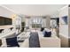Bright living room with hardwood floors, white sofas, and access to a balcony at 3435 Kingsboro Ne Rd # 603, Atlanta, GA 30326