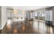 Hardwood floors and natural light fill this living room with sliding doors to a balcony at 3435 Kingsboro Ne Rd # 603, Atlanta, GA 30326