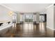 Spacious living room with hardwood floors and access to the outdoor patio with city views at 3435 Kingsboro Ne Rd # 603, Atlanta, GA 30326