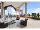 Outdoor patio with covered seating, stone pillars, and a city view at 3435 Kingsboro Ne Rd # 603, Atlanta, GA 30326