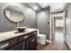 Stylish powder room with a unique vessel sink, dark wood vanity and views to another room at 3435 Kingsboro Ne Rd # 603, Atlanta, GA 30326