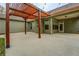 The covered patio features an eye-catching pergola and concrete flooring at 9117 Dearing St, Covington, GA 30014