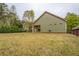Spacious backyard with mature trees and landscaped lawn at 9117 Dearing St, Covington, GA 30014