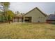 Home featuring a large backyard, patio, and wooden pergola at 9117 Dearing St, Covington, GA 30014