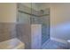 Modern bathroom with tiled shower and glass door, along with a soaking tub at 9117 Dearing St, Covington, GA 30014