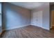 Well-lit room with sleek hardwood floors and ample closet space at 9117 Dearing St, Covington, GA 30014