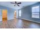 Large bedroom with ensuite bathroom and walk-in closet with lots of natural light at 9117 Dearing St, Covington, GA 30014