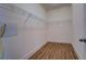 Walk-in closet with wire shelving and wood floor at 9117 Dearing St, Covington, GA 30014