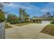 Inviting single-story home with a spacious driveway, attached garage, and well-manicured lawn at 9117 Dearing St, Covington, GA 30014