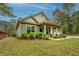Charming home featuring a cozy front porch, manicured landscaping, and a welcoming facade at 9117 Dearing St, Covington, GA 30014
