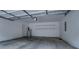Spacious garage with storage shelves and high ceilings at 9117 Dearing St, Covington, GA 30014