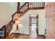 Inviting foyer with a wooden staircase and hardwood floors at 103 Nob Hl, Peachtree City, GA 30269