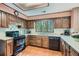 Well-maintained kitchen with sleek black appliances and ample counter space at 103 Nob Hl, Peachtree City, GA 30269
