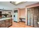Functional kitchen area with built-in cabinets and access to other living spaces at 103 Nob Hl, Peachtree City, GA 30269