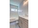 Bathroom featuring a tub/shower with herringbone tile, a modern vanity with a white marble countertop, and tile flooring at 158 Hemphill School Rd, Atlanta, GA 30331