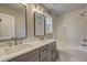 Modern bathroom featuring double vanity with quartz countertop and stylish herringbone-patterned tile at 158 Hemphill School Rd, Atlanta, GA 30331