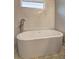 Luxurious freestanding bathtub with sleek fixtures and elegant tile accents, offering a spa-like experience at 158 Hemphill School Rd, Atlanta, GA 30331