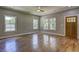 Bright bedroom with natural light and gleaming hardwood floors, offering a comfortable atmosphere at 158 Hemphill School Rd, Atlanta, GA 30331
