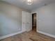 Comfortable bedroom featuring hardwood floors, a modern ceiling light fixture, and a convenient closet space at 158 Hemphill School Rd, Atlanta, GA 30331