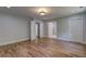 Spacious bedroom featuring hardwood floors and a modern ceiling light fixture, perfect for relaxation and comfort at 158 Hemphill School Rd, Atlanta, GA 30331