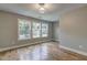Bright bedroom featuring hardwood floors and large windows, creating a welcoming and airy atmosphere at 158 Hemphill School Rd, Atlanta, GA 30331