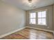 Inviting bedroom with hardwood floors and a modern ceiling light fixture, creating a cozy and stylish ambiance at 158 Hemphill School Rd, Atlanta, GA 30331
